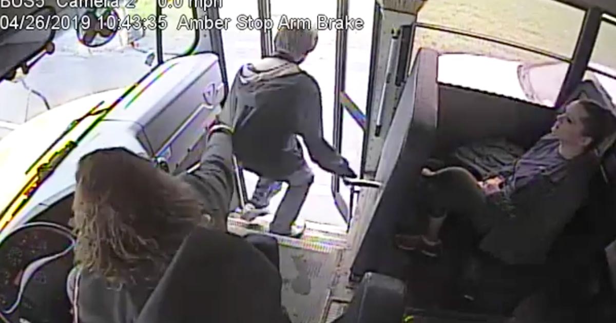 bus driver stops boy from hitting car