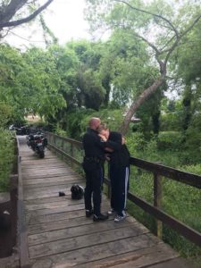 officer hugs man with special needs