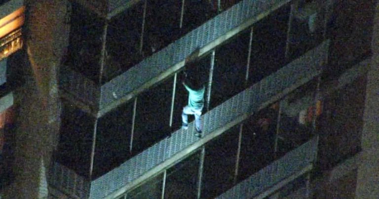 man-climbs-building-save-mom