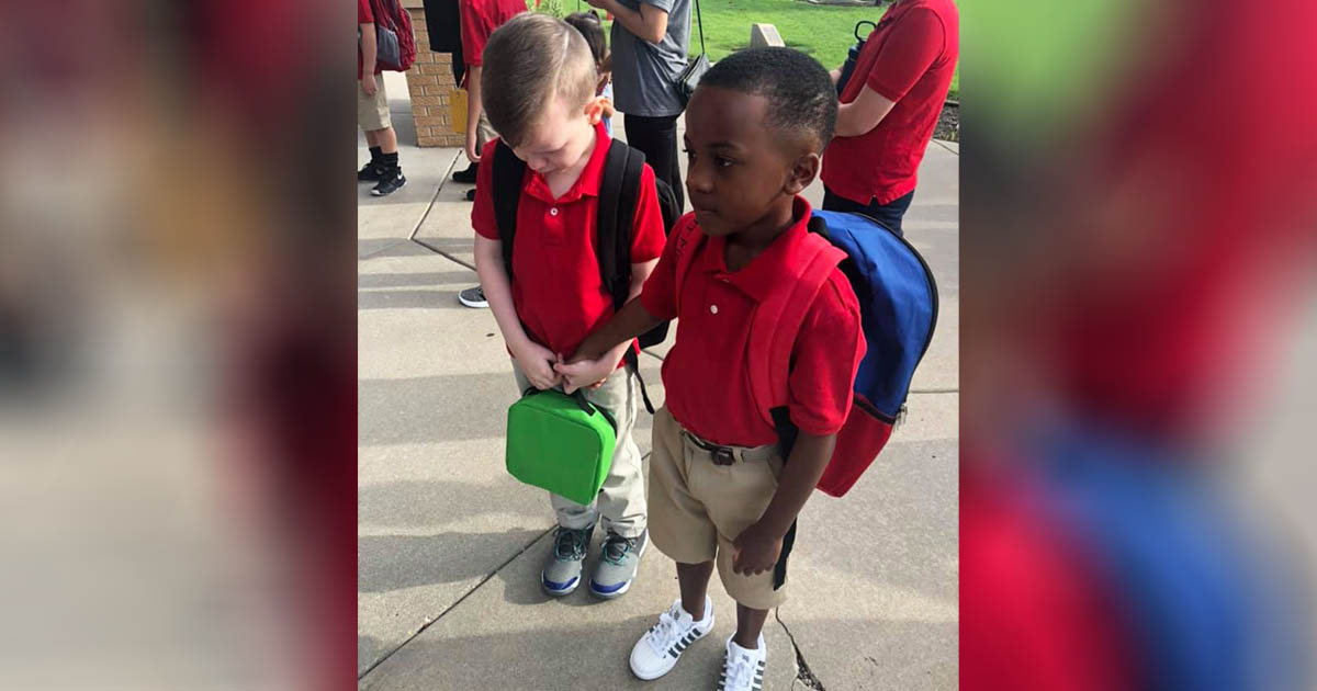 boy-comforts-crying-autistic-classmate