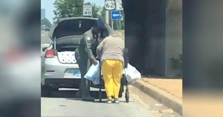 Airman-helps-elderly-woman