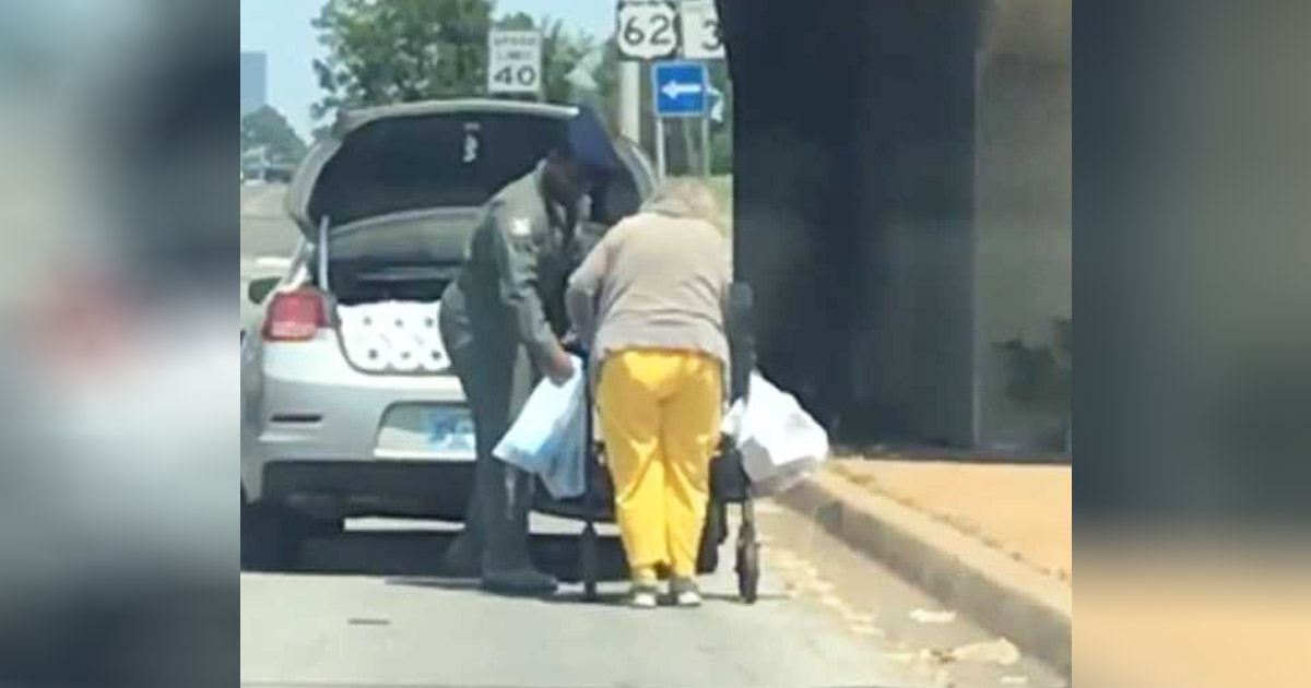 Airman-helps-elderly-woman