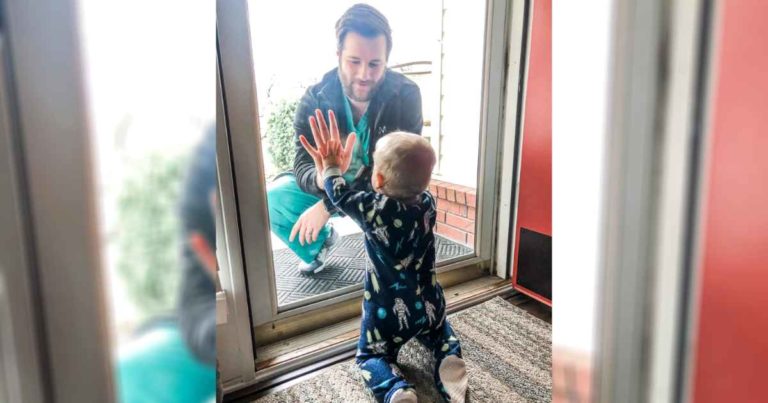 doctor-sees-son-through-glass-door