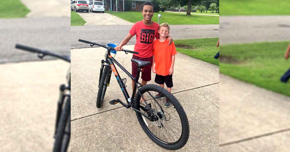 boy-gives-friend-bike