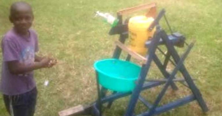 kenyan-boy-hand-washing-machine