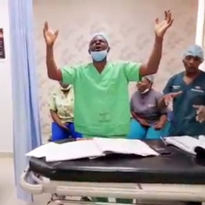 surgeon-worshipping-god-with-patient-3
