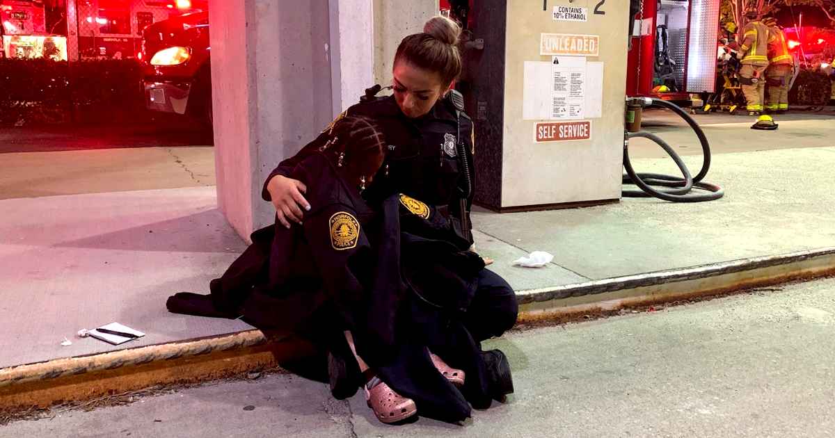 officer-calming-child-after-crash
