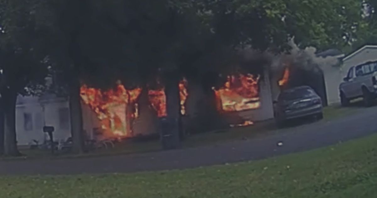 officer rescues disabled woman from house fire