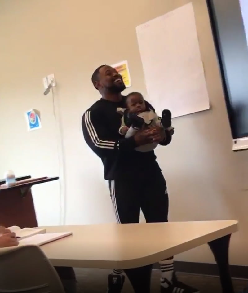 professor-holds-baby-during-class