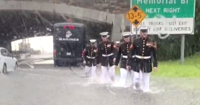 marines help woman in flood
