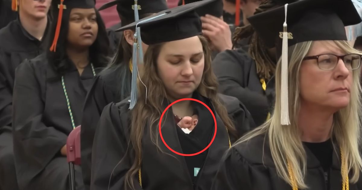 woman graduates with baby grace szymchack