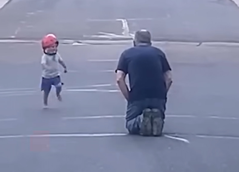 little boy runs to hug grandpa