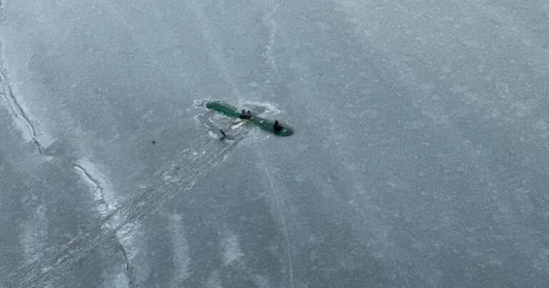 plane lands on frozen lake