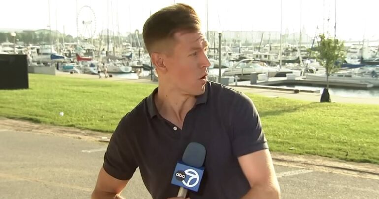 reporter helping cyclist christian piekos