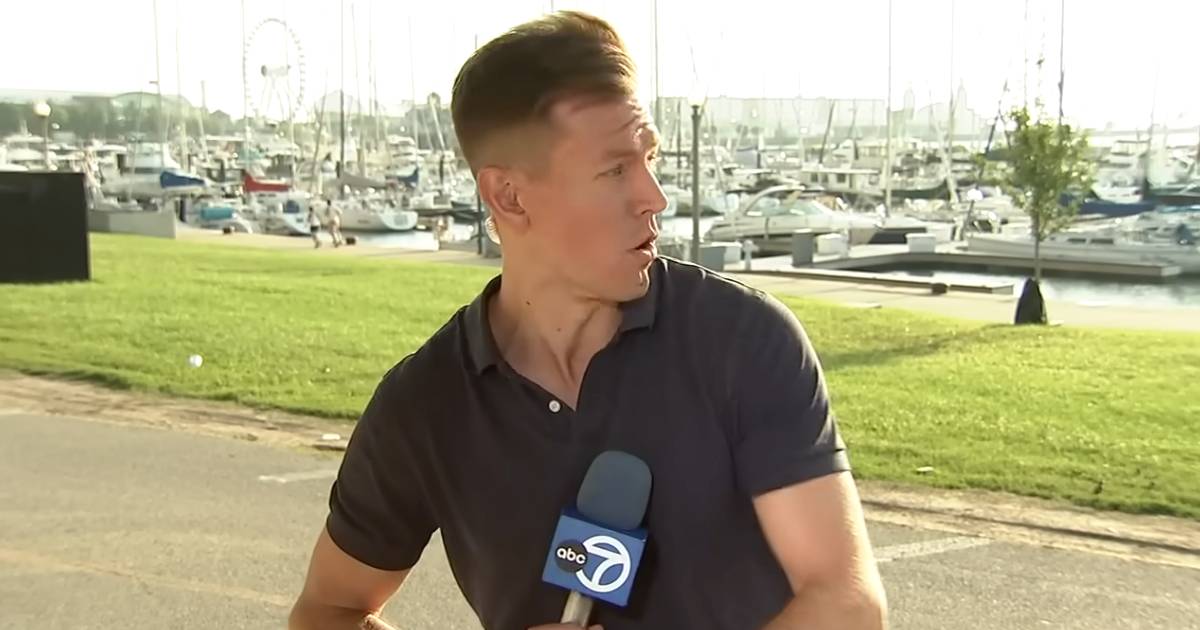 reporter helping cyclist christian piekos