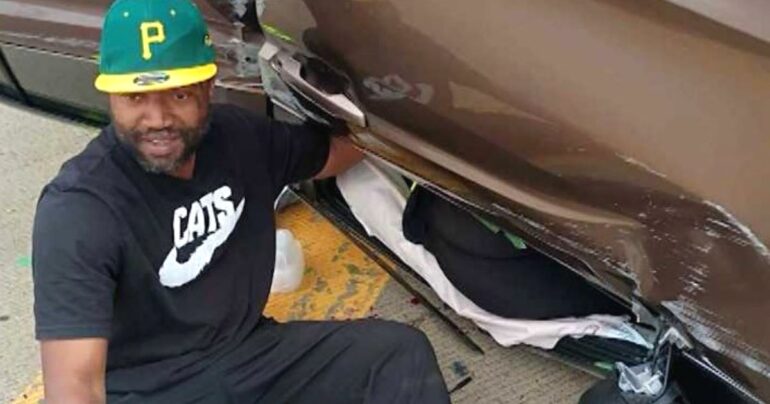 man comforting crash victim