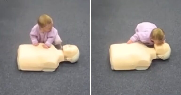 baby doing cpr on dummy video