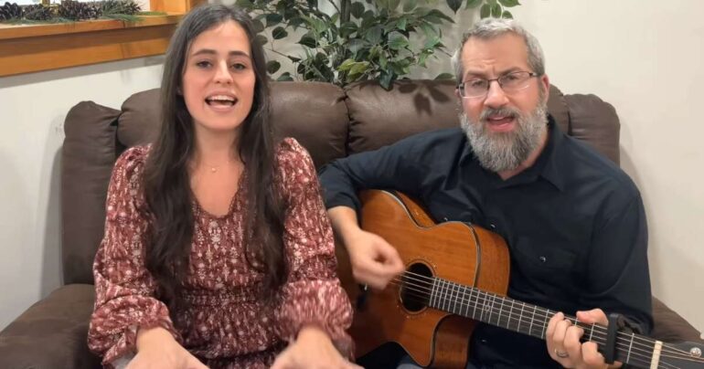 couple singing victory in jesus