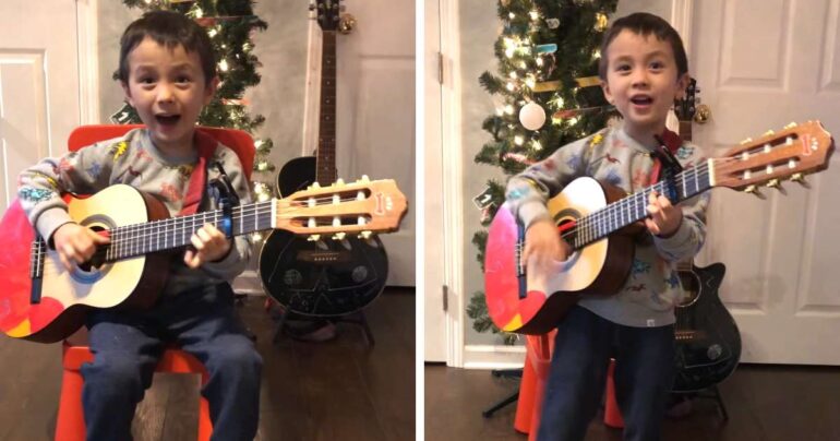 little boy singing feliz navidad