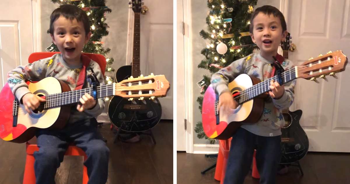 little boy singing feliz navidad